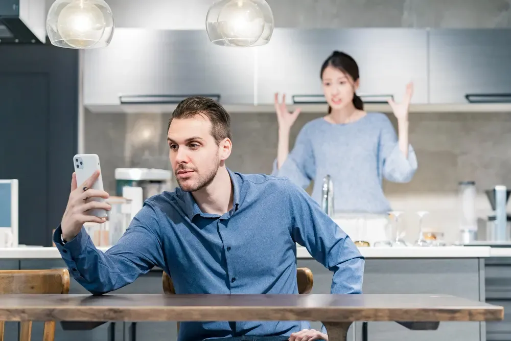 My Husband Is Always on His Phone & Ignores Me: How to Reconnect
