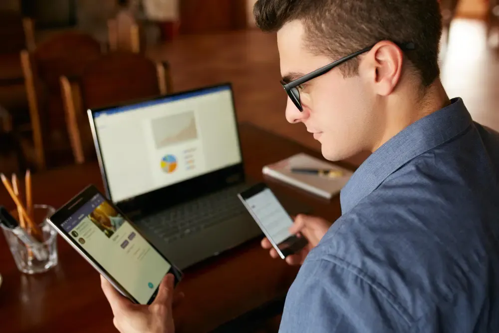 Person turning off smartphone to disconnect digitally.webp